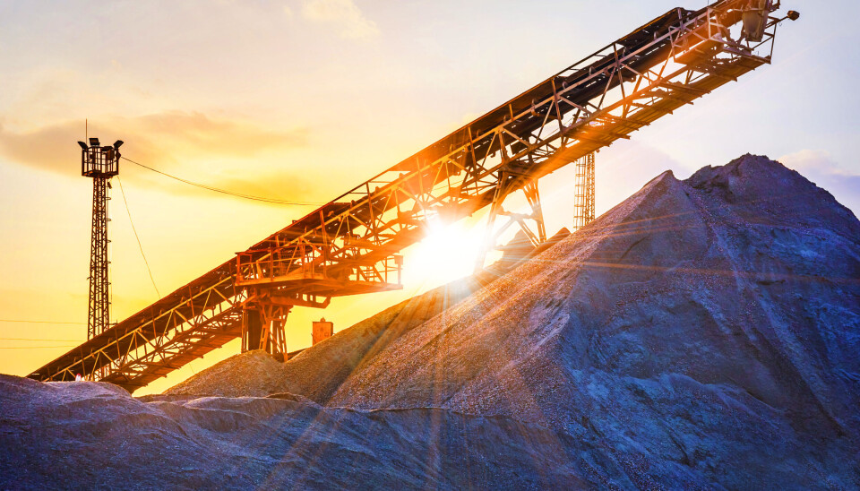 gravel pit with an industrial gravel sorter machinery with beautiful sunburst color effect